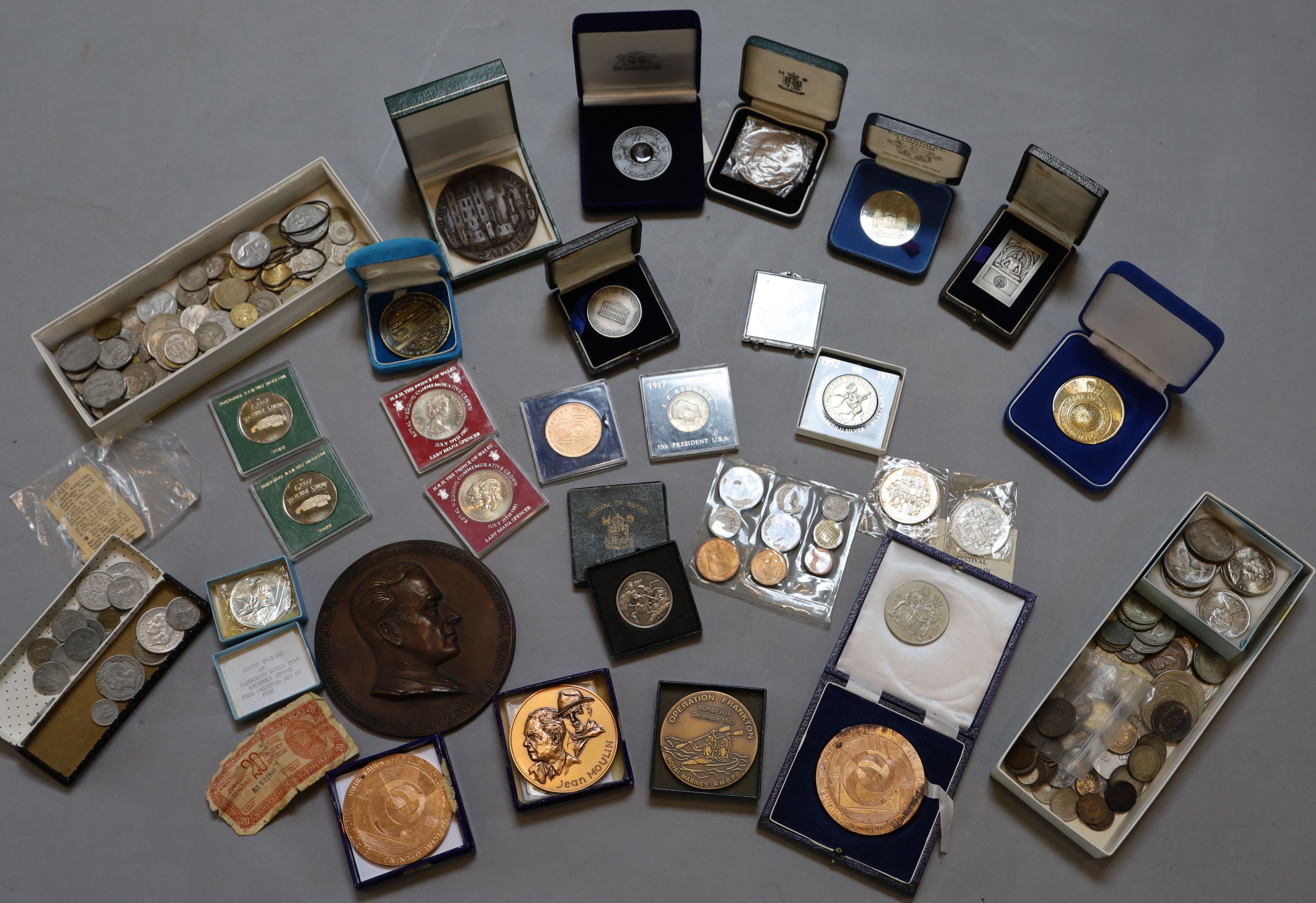 A collection of assorted coins and medallions